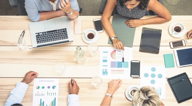 People sitting around a conference table