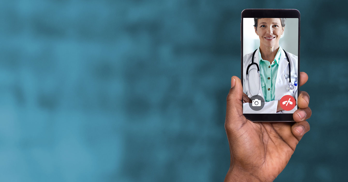 bnr-md-live Person holding phone while video chatting with a doctor