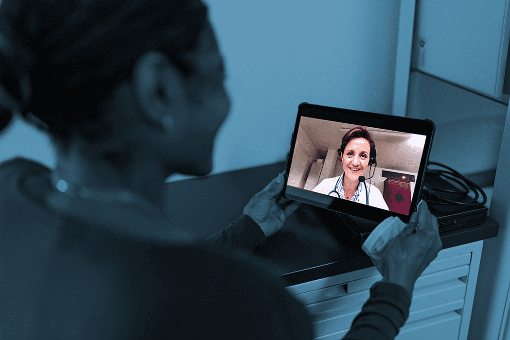 bnr-virtualhealth lady holding tablet with doctor on it for virtual health visit
