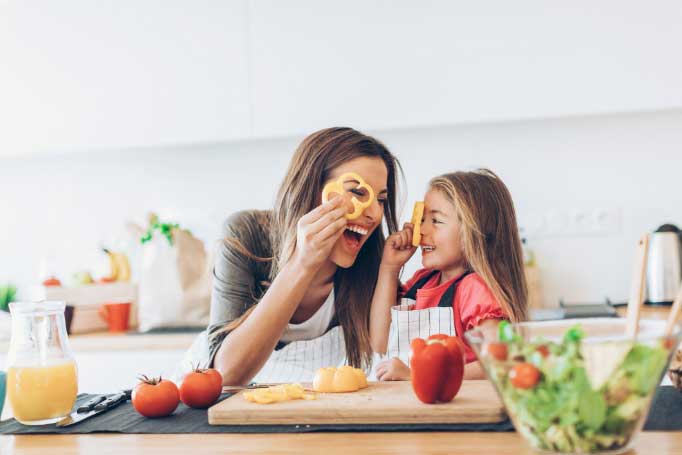 family-cooking Woman and child cooking in a kitchen